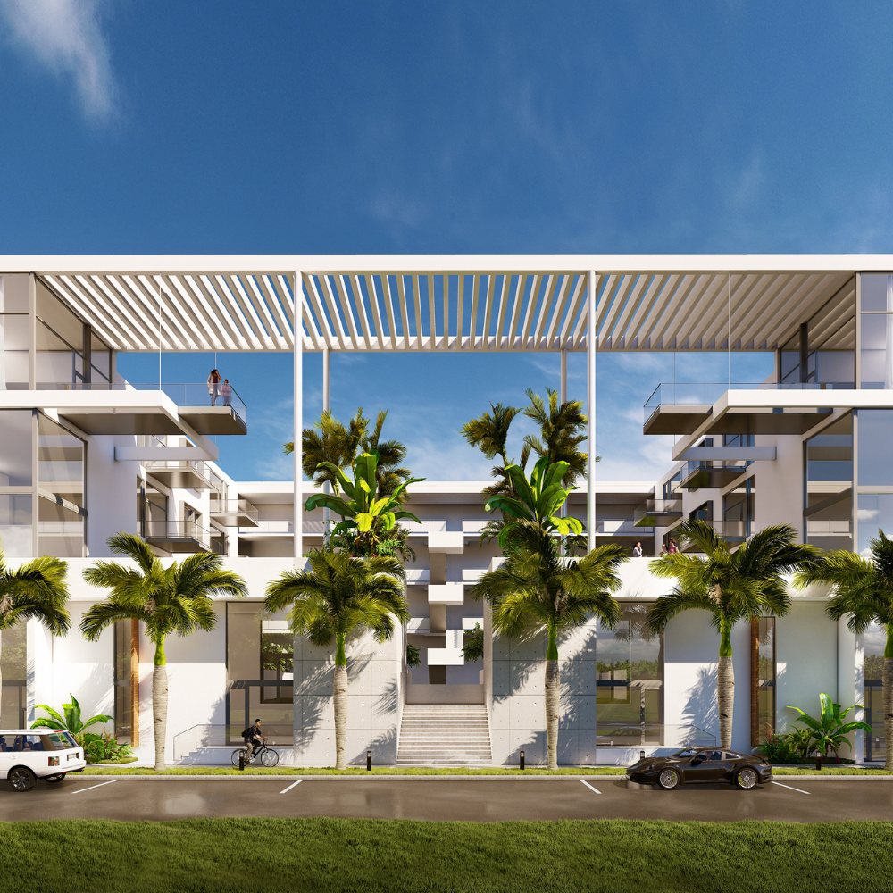 Modern white building with large glass windows, balconies, palm trees in front, and contemporary geometric design. Two cars and a motorcycle are parked on the street; two people are seen on different balconies.