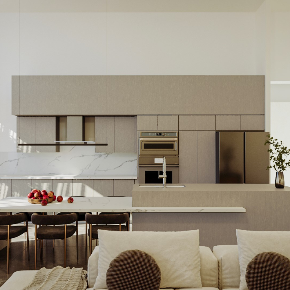 Modern kitchen with beige cabinets, marble backsplash, stainless steel appliances, island with sink, and a dining table with chairs. A bowl of apples and a vase with greenery decorate the space. Light enters from the left.