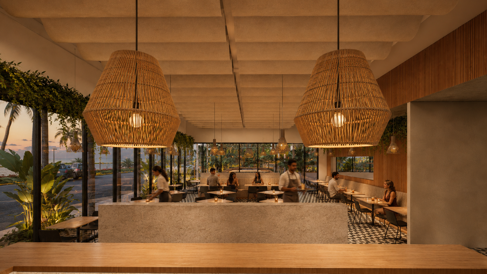 A warm, modern restaurant interior with large wicker pendant lights, a checkered floor, and floor-to-ceiling windows looking out onto a palm-lined sunset landscape. Waitstaff serve tables while diners sit in a relaxed, upscale atmosphere.