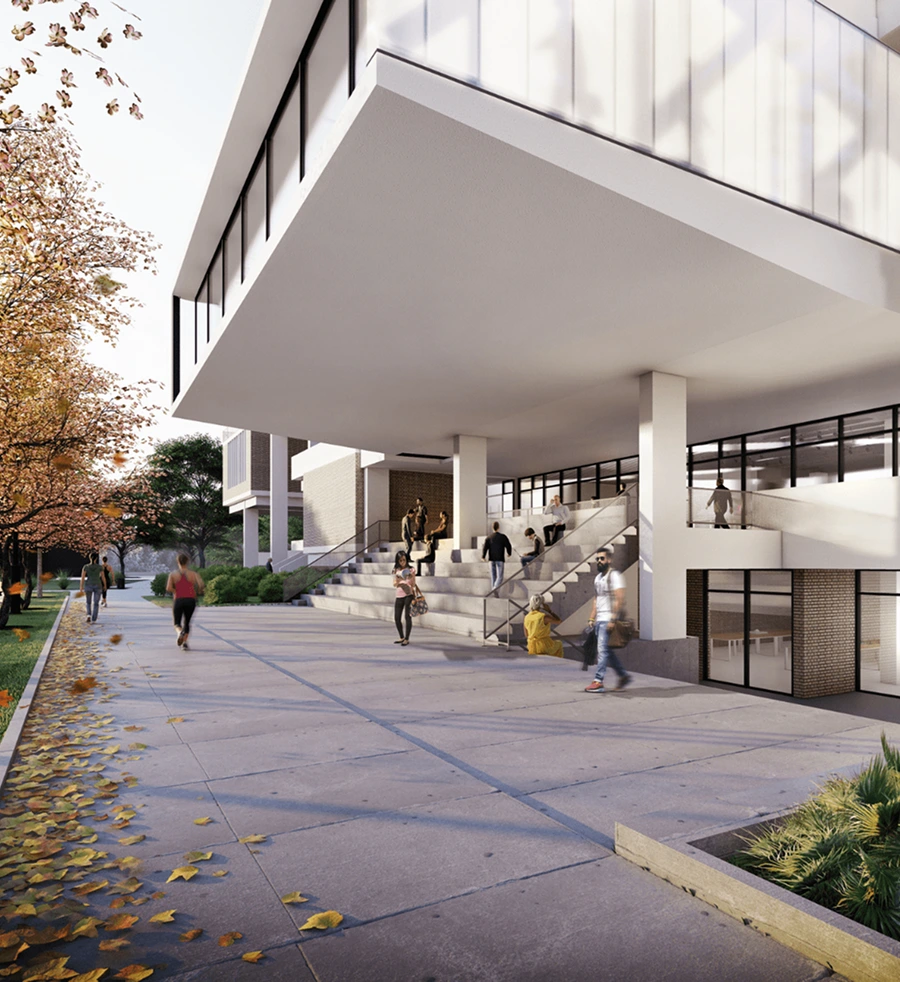 People walk and sit outside a modern Halflants + Pichette building with large overhangs, glass windows, and stairs. Fallen autumn leaves scatter the wide sidewalk beneath trees with orange leaves.